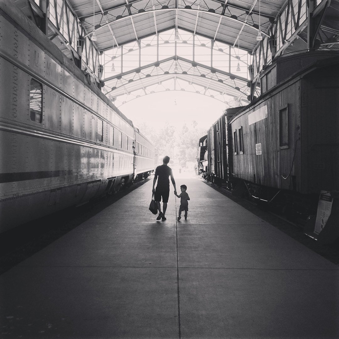 Walking hand in hand at the train station
